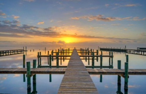 Balcony w Bay View Shared Pool Boat Dock Fat Flounder by AvantStay